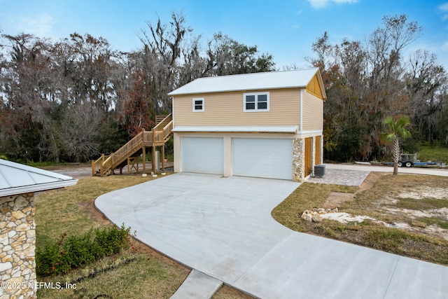 view of side of home featuring a garage