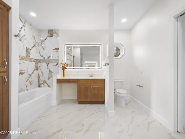 bathroom featuring vanity, a bathing tub, and toilet