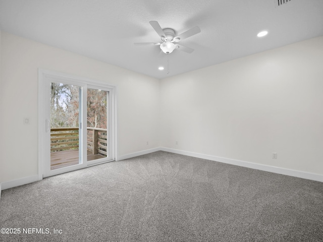 carpeted empty room featuring ceiling fan