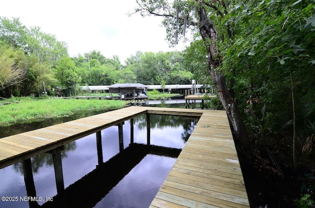 view of dock with a water view