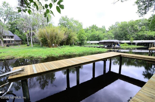 dock area featuring a water view