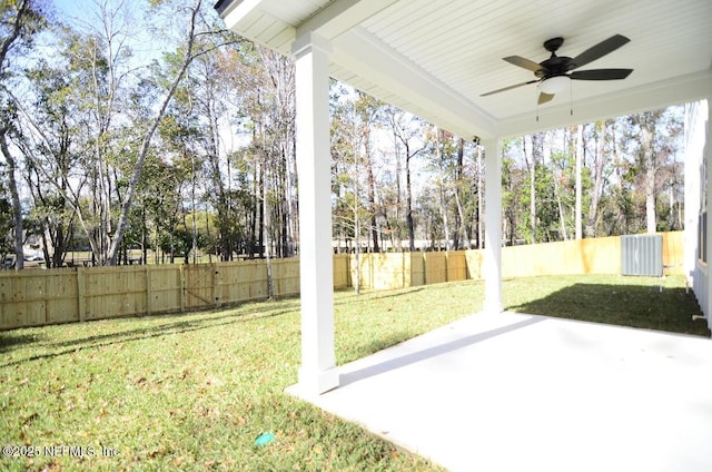 view of yard with a patio area and ceiling fan