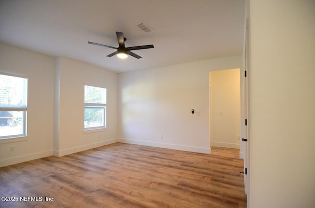 empty room with light wood-type flooring and ceiling fan