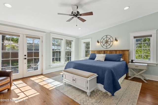 bedroom with vaulted ceiling, ornamental molding, ceiling fan, access to exterior, and light hardwood / wood-style floors