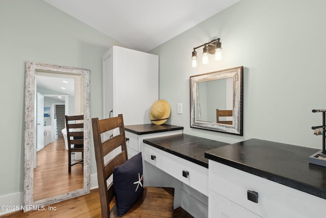 bathroom with hardwood / wood-style flooring