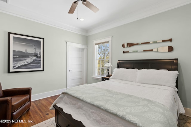 bedroom with crown molding, dark hardwood / wood-style floors, and ceiling fan