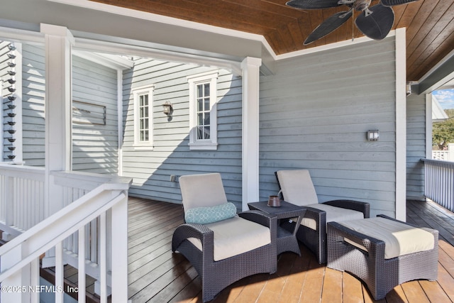 wooden terrace featuring ceiling fan