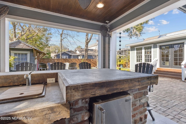 view of patio / terrace with french doors and exterior bar