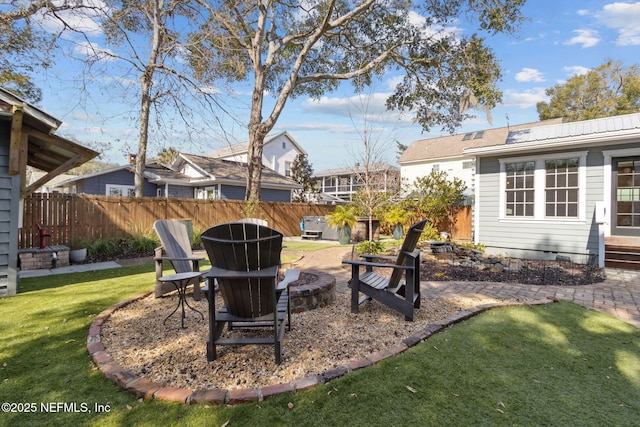 view of yard with a fire pit