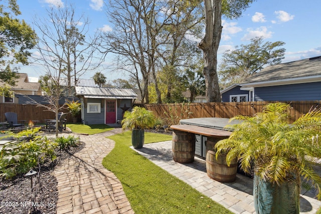 view of yard with an outbuilding and a patio area