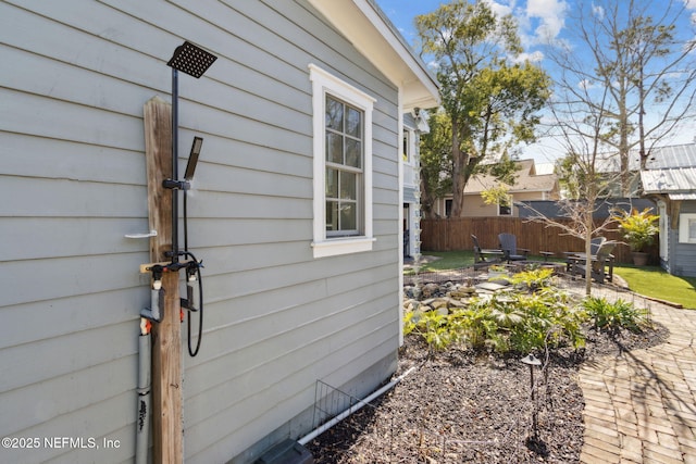 view of side of home featuring a patio area