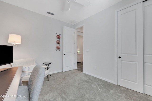 home office featuring baseboards, visible vents, ceiling fan, and carpet flooring