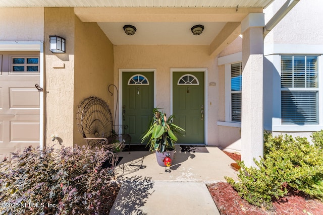 doorway to property featuring a garage