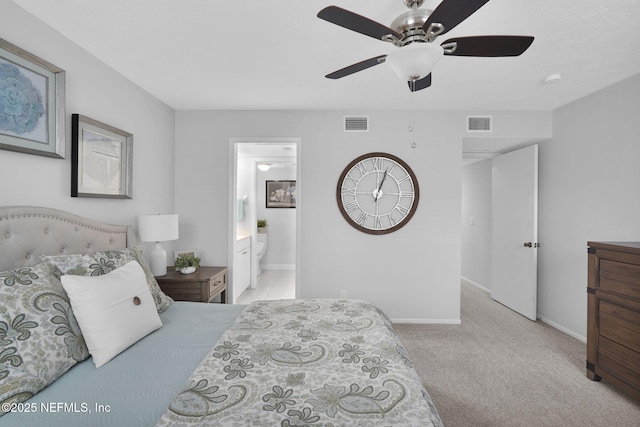 carpeted bedroom with connected bathroom and ceiling fan