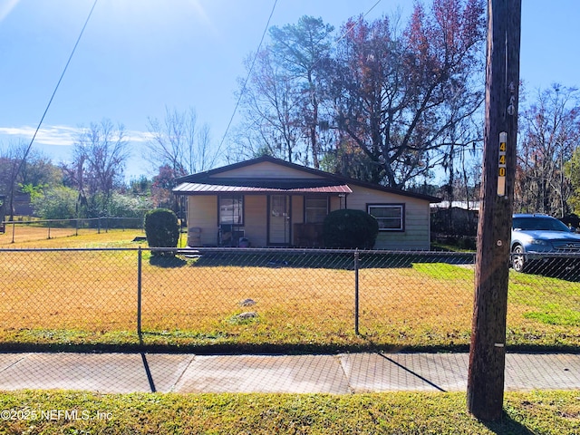 bungalow-style house with a front yard