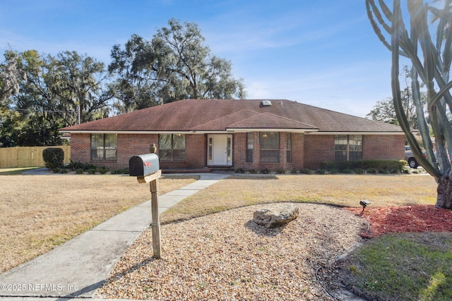 ranch-style house with a front lawn