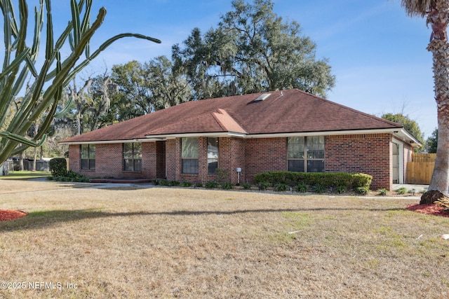 ranch-style house with a front lawn