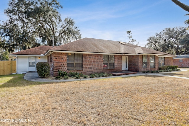 ranch-style home with a front yard