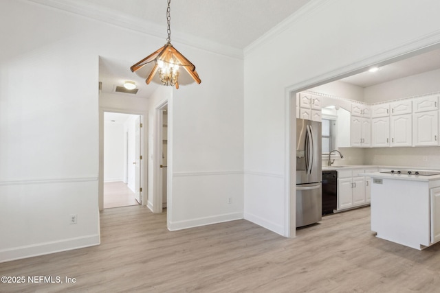 kitchen with sink, light hardwood / wood-style flooring, white cabinetry, black appliances, and decorative light fixtures