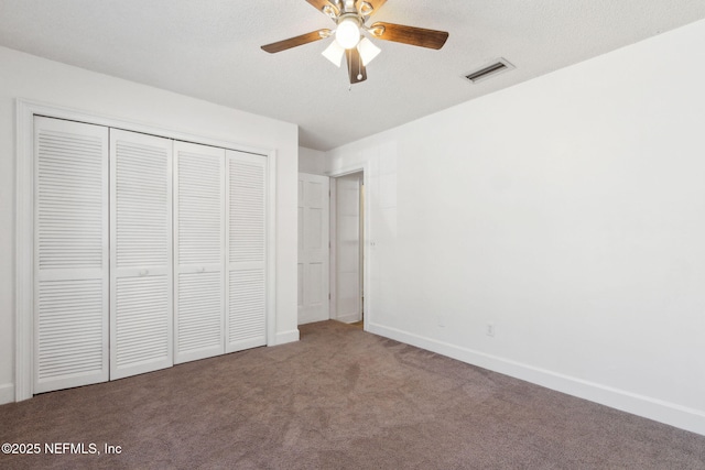 unfurnished bedroom featuring a closet, ceiling fan, and carpet flooring