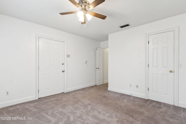 unfurnished room with light carpet and ceiling fan