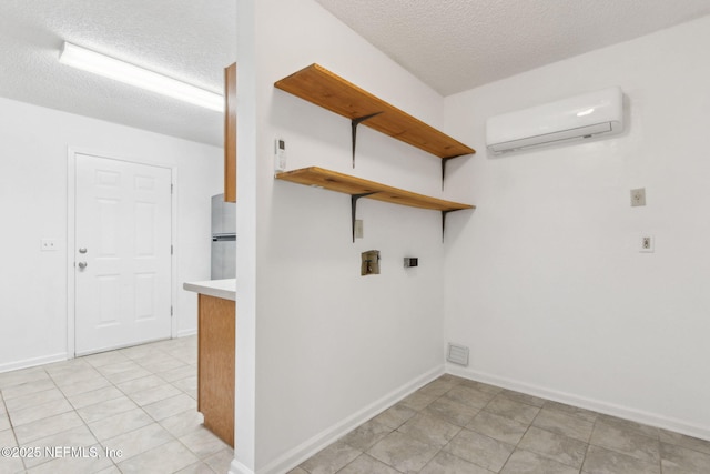 clothes washing area with a wall mounted AC and a textured ceiling