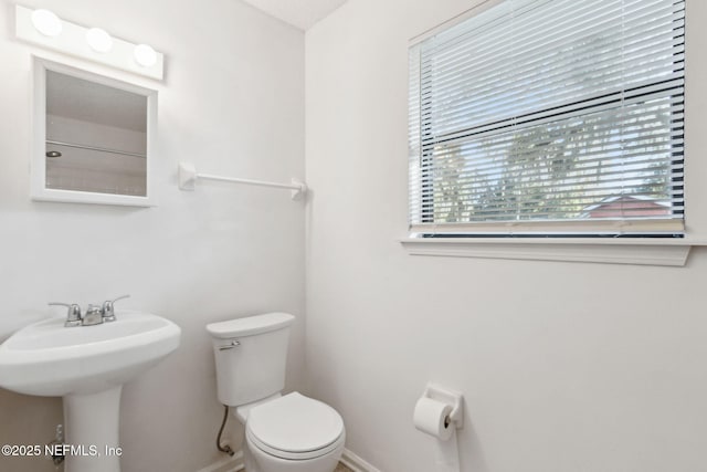 bathroom with toilet and sink