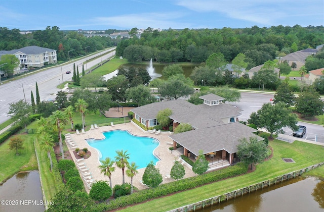 birds eye view of property with a water view