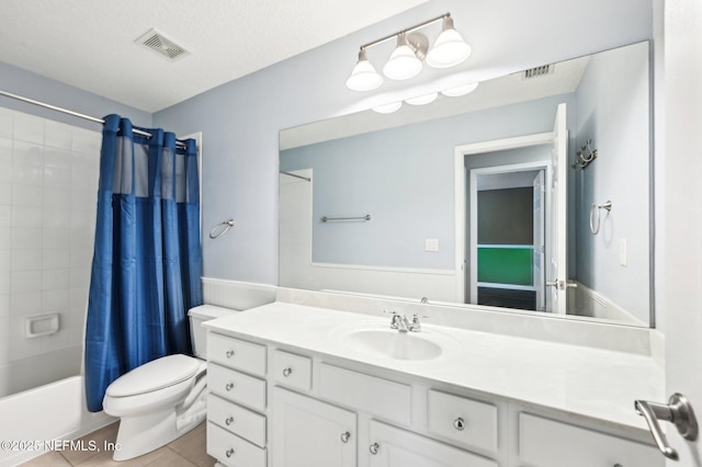 full bathroom featuring shower / tub combo, vanity, toilet, and tile patterned flooring