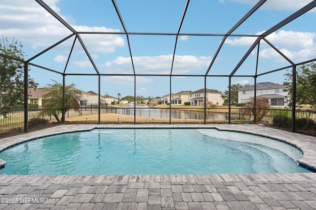 view of swimming pool featuring a lanai and a patio