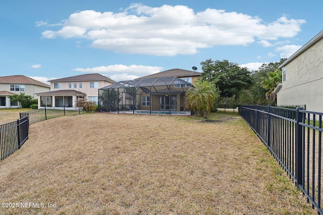 view of yard featuring a fenced in pool and a lanai