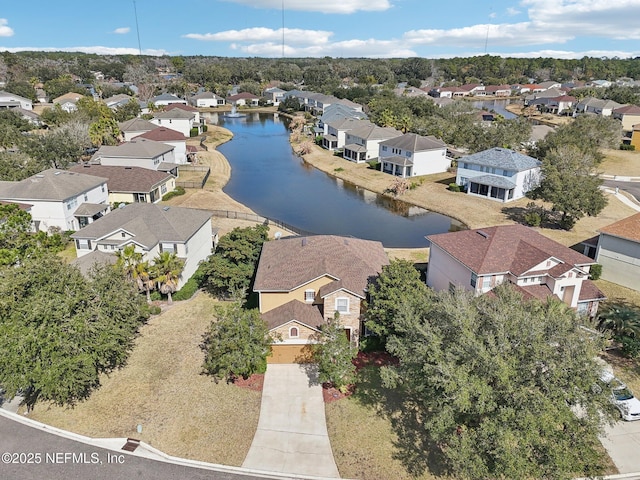 drone / aerial view with a water view