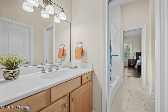 bathroom featuring vanity, shower / tub combo with curtain, and tile patterned flooring