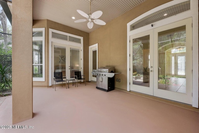 view of patio with ceiling fan, grilling area, and french doors