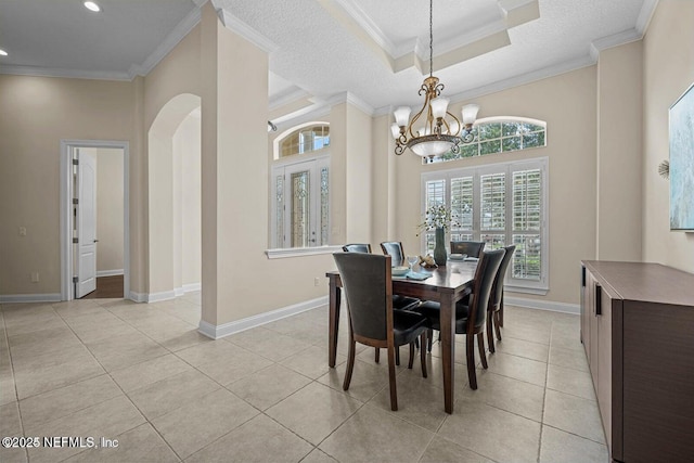 dining room featuring ornamental molding and light tile patterned flooring