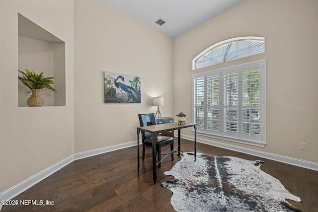 office space with dark wood-type flooring