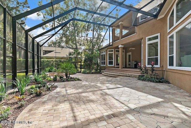 view of patio with a lanai and ceiling fan