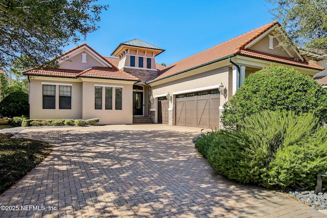 mediterranean / spanish house featuring a garage