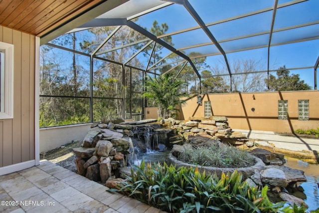 view of patio / terrace with a lanai