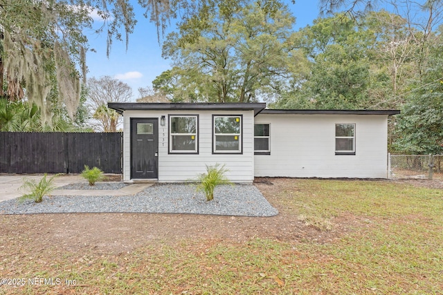 view of outbuilding with a yard