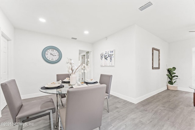 dining area featuring light wood-type flooring