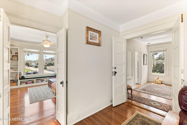 entryway featuring hardwood / wood-style flooring and ceiling fan