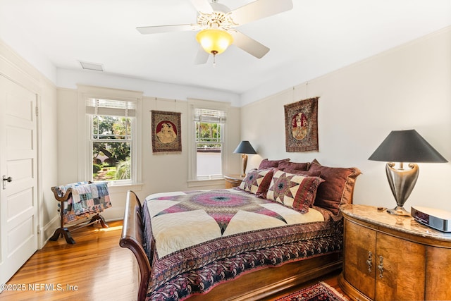 bedroom featuring wood-type flooring and ceiling fan