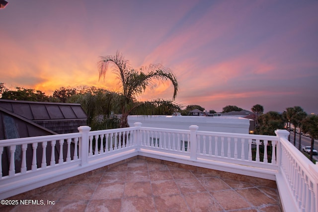 view of patio terrace at dusk