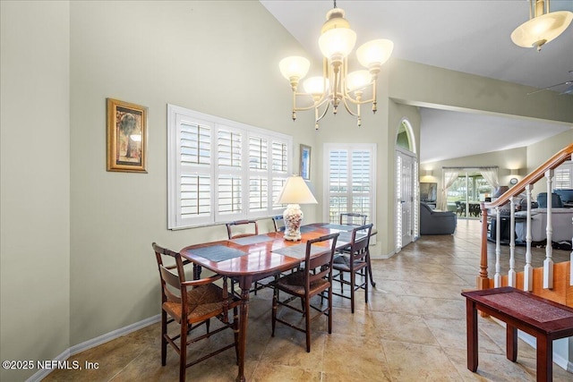 dining room with a chandelier and a high ceiling