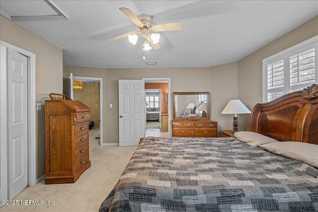 bedroom with light carpet, a textured ceiling, and ceiling fan