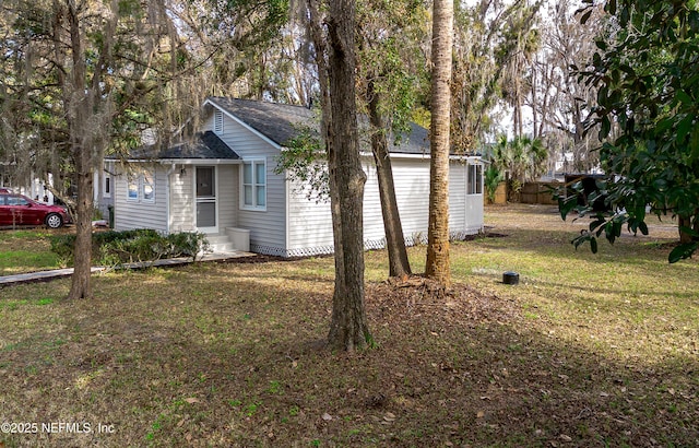 view of home's exterior featuring a lawn