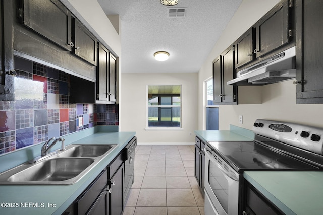 kitchen featuring stainless steel electric stove, a textured ceiling, black dishwasher, sink, and light tile patterned floors