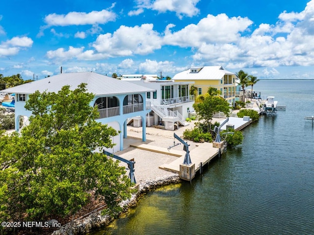 view of dock featuring a deck with water view