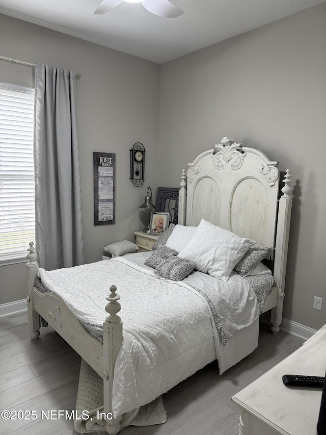 bedroom featuring ceiling fan and hardwood / wood-style floors